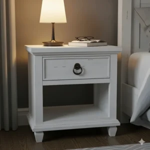 A white farmhouse nightstand with a dark bronze handle, perfect for storing bedside essentials.