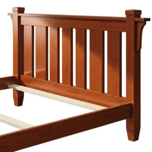 Close-up of a sturdy mission bed frame, highlighting its vertical slat headboard and rich cherry finish.