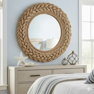 A decorative round mirror framed with thick rope, enhancing the nautical theme of the beach bedroom furniture collection.
