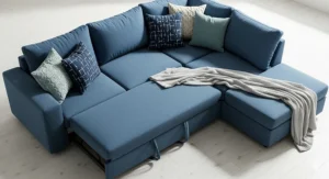 An overhead shot of the modular blue sectional sleeper sofa with decorative throw pillows and a cozy blanket.