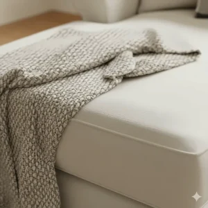 Textured shot showing the weave and finish of the washable slipcover material on the farmhouse sectional sofa.