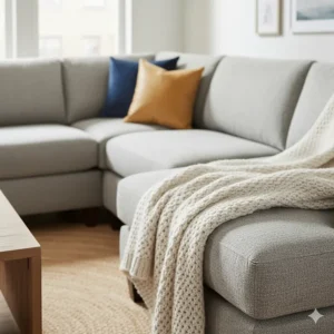 Macro shot highlighting the durable linen fabric upholstery and supportive cushions on a quality sectional sofa under $1000.