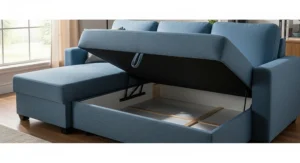 Image showing the hidden storage compartment under the chaise of the blue sectional sofa sleeper.