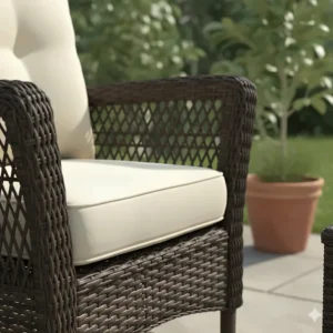 Close-up of durable, all-weather resin wicker patio furniture showing the intricate woven texture and thick cushions.