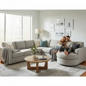 A couple comfortably relaxing and lounging together on their spacious, cream-colored cuddler sectional sofa.