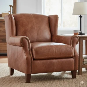 A comfortable distressed leather armchair with nailhead trim, a classic piece of rustic living room furniture.