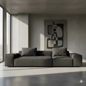 A low-profile, modular sofa upholstered in a dark, textured fabric, typical of brutalist furniture design.