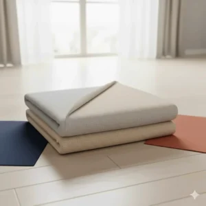 Image displaying a reversible sofa slip cover for sectionals folded to show two different color options for versatile styling.