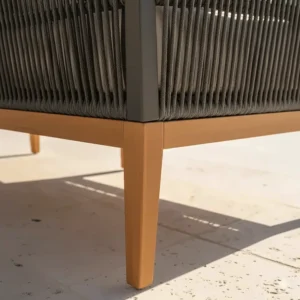 Detail view of an anti-rust aluminum frame supporting a section of the rope outdoor sofa, highlighting durability.