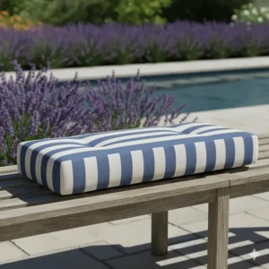 Custom-sized replacement cushion for an outdoor patio bench in a striped pattern.