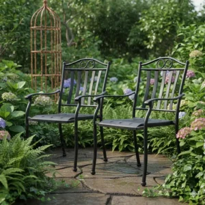 Weather-resistant, powder-coated wrought iron patio chairs resisting rust in a garden setting.