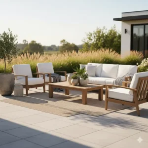 Illustration showing how to style Four Hands outdoor furniture with neutral rugs and ceramic planters.