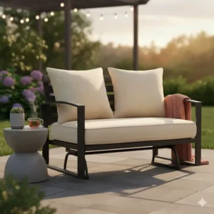 An outdoor patio furniture glider styled with decorative throw pillows and a side table.