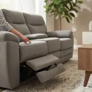 Close-up of a power reclining sofa and loveseat set showing the smooth motorized footrest extension.