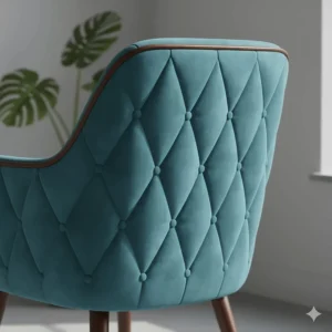 Detailed illustration of the button-tufted upholstery on the back of a teal mid century accent chair.