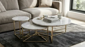 High-end interior design visualization highlighting a luxury set of faux marble nesting coffee tables with brushed gold geometric frames.