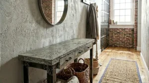 Contemporary luxury narrow console table with a gold frame and a white faux marble top.