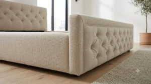 Close-up of durable textured upholstery and stitching on a bed frame designed for headboard-free rooms.
