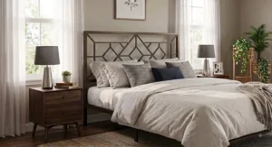 Bronze geometric metal queen headboard paired with neutral bedding in an apartment bedroom.