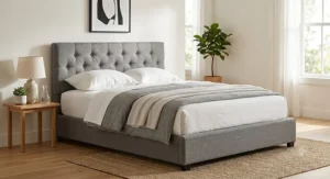 Gray upholstered queen bed frame under $300 featuring a button-tufted headboard