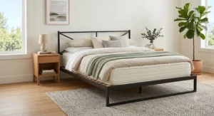 Durable steel no-boxspring bed frame with supportive wooden slats holding a memory foam platform mattress.