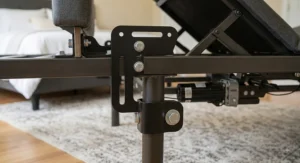 Close-up view of heavy-duty mounting hardware secure on a queen adjustable bed frame leg.
