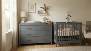 A stylish gray dresser for a nursery changing-table combo part of a matching nursery furniture set.